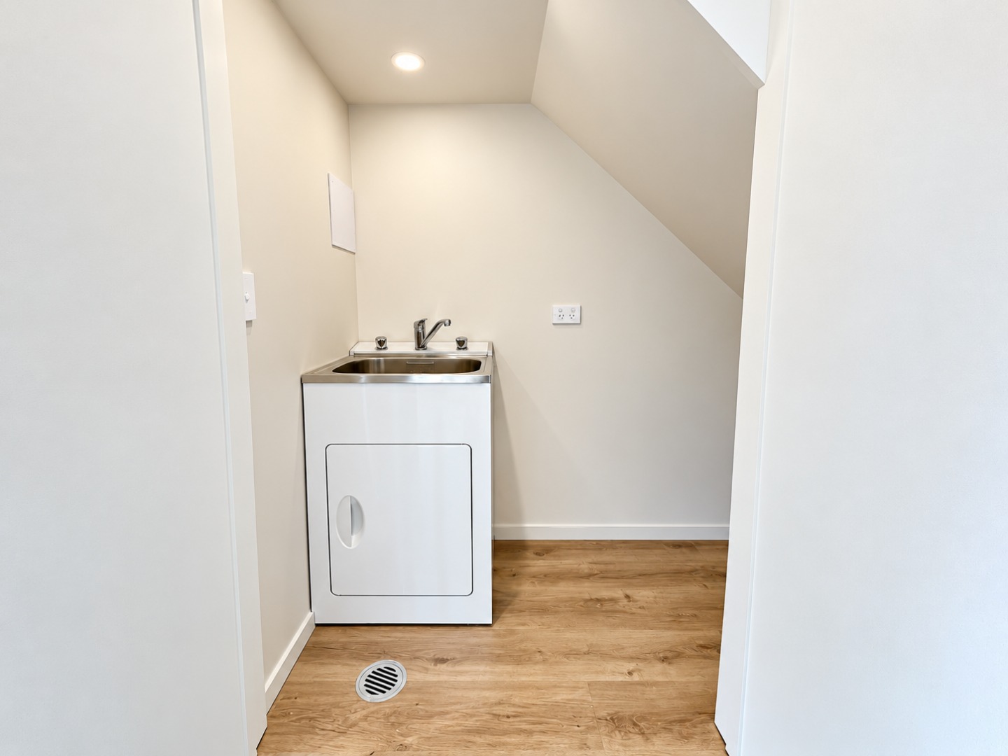 Minimalist Laundry Nook with Utility Sink