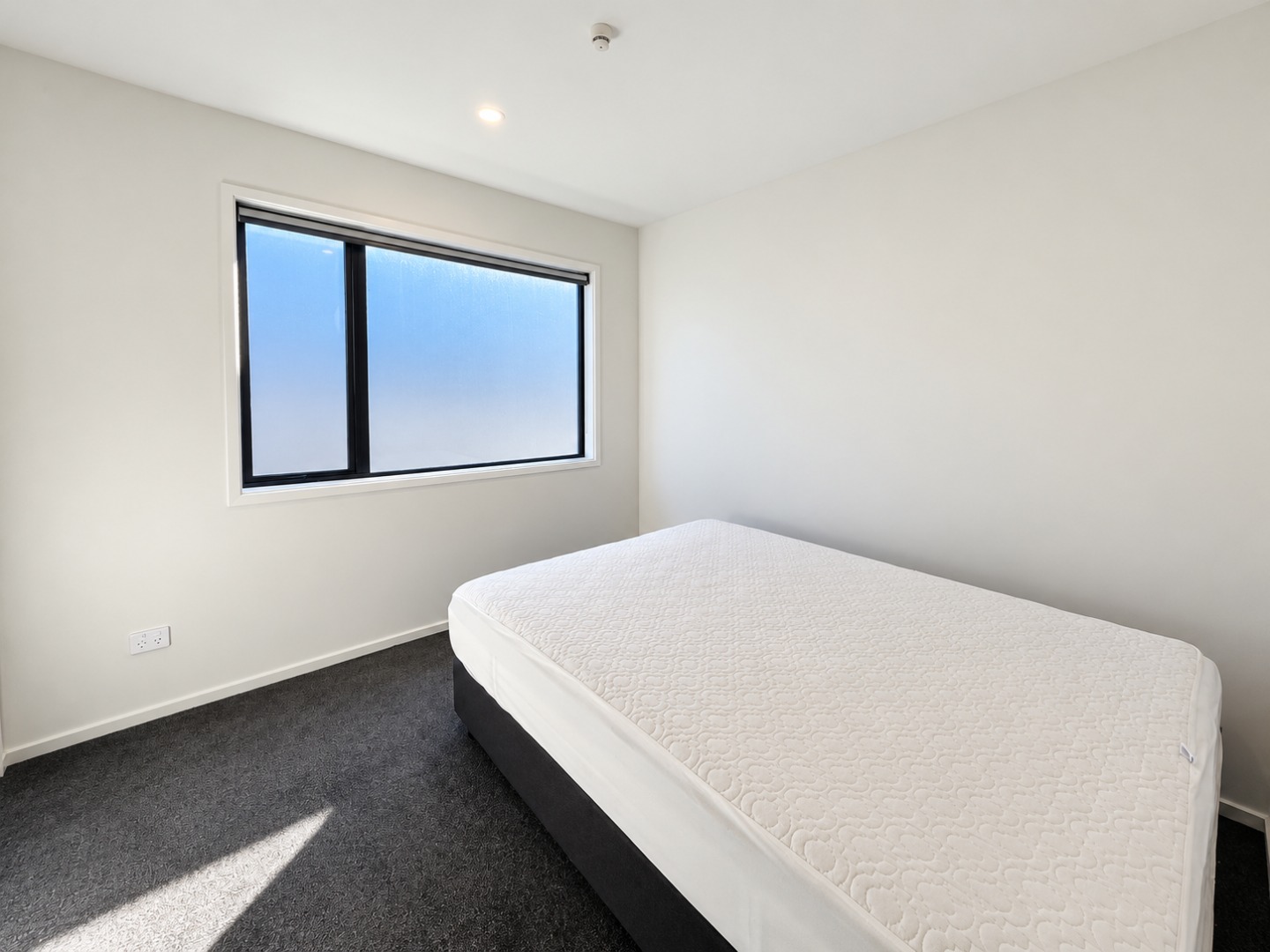 Bright Minimal Bedroom with Frosted Window