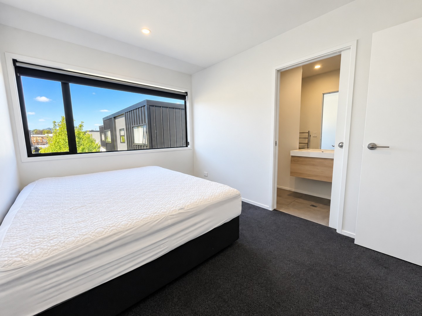 Bright Minimalist Bedroom with Ensuite View