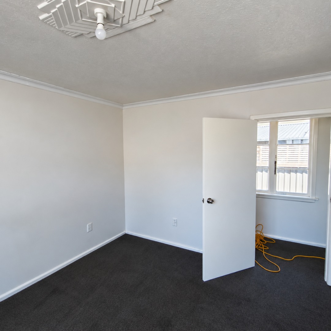 Empty Room with Open Door and Cable
