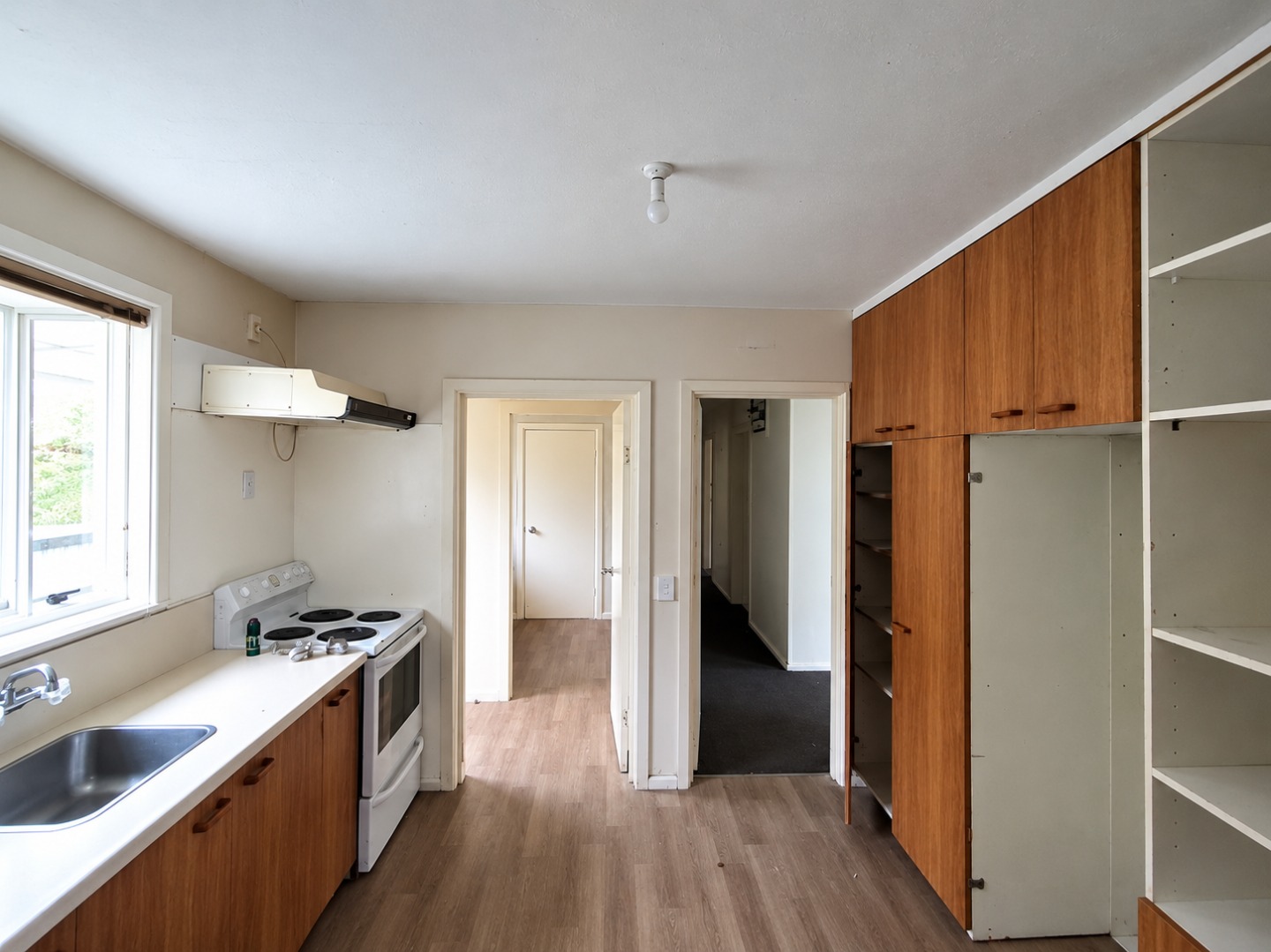 Modest Kitchen with Open Doorways