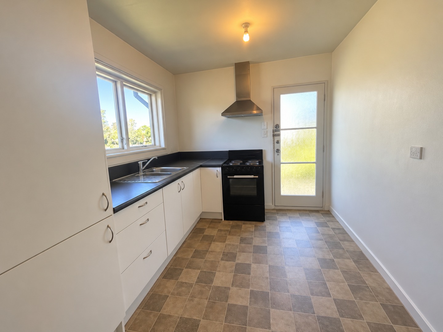 Minimalist Galley Kitchen in Warm Daylight