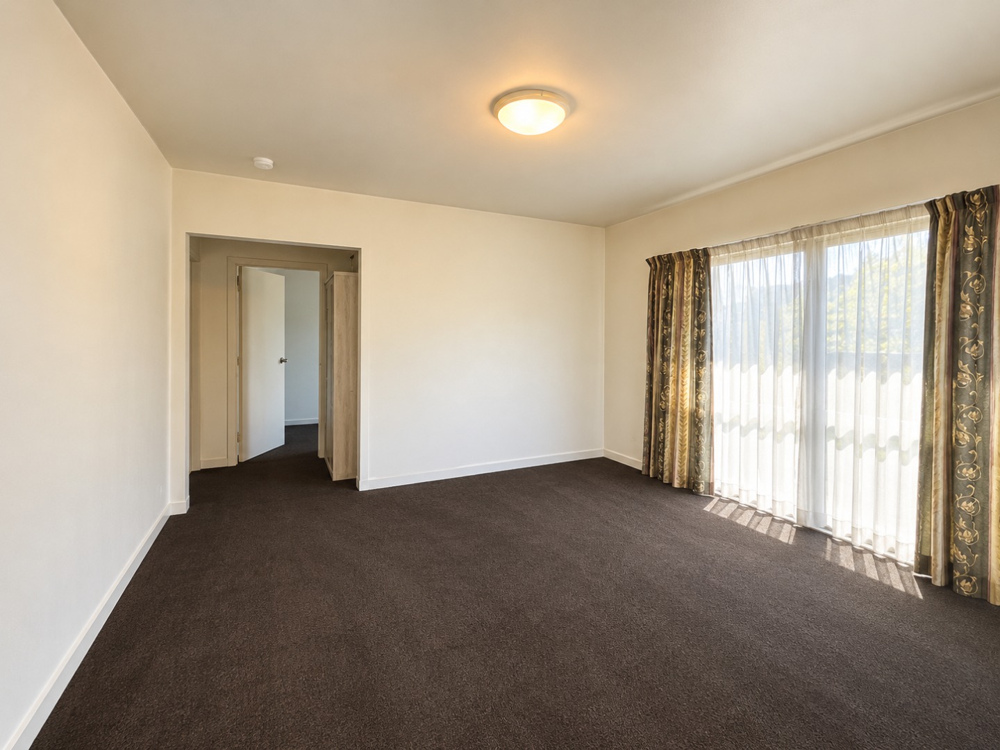 Empty Sunlit Living Room Interior