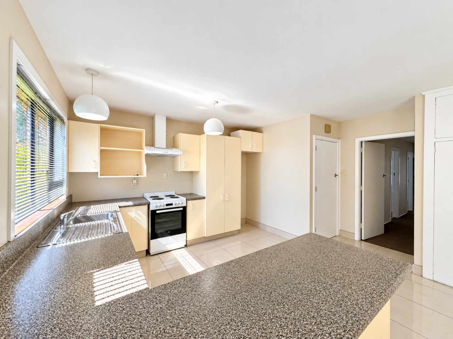 Bright Modern Kitchen with Sunlit Hallway