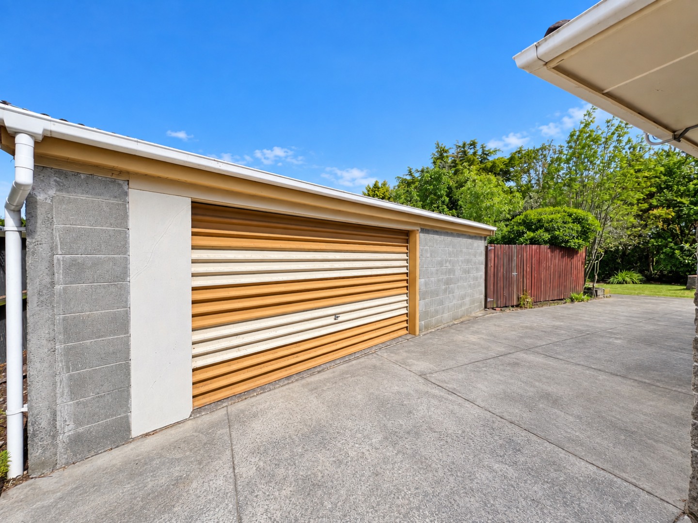 Bright Suburban Garage and Driveway