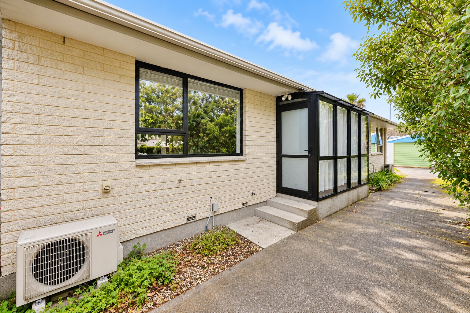 Sunny Suburban Entryway with Mitsubishi HVAC
