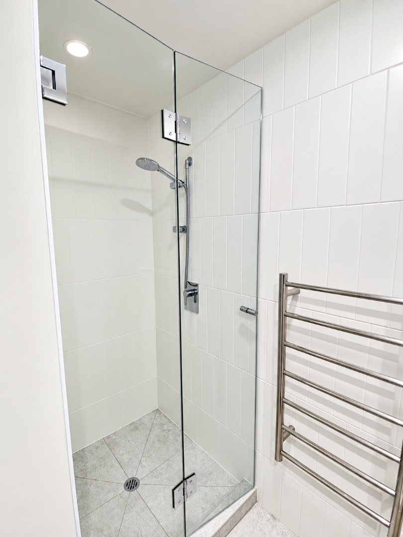 Modern Frameless Shower with Chrome Fixtures