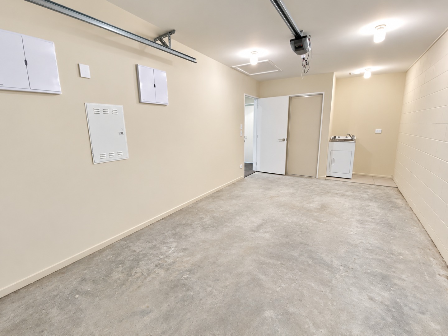 Bright Empty Garage Laundry Room