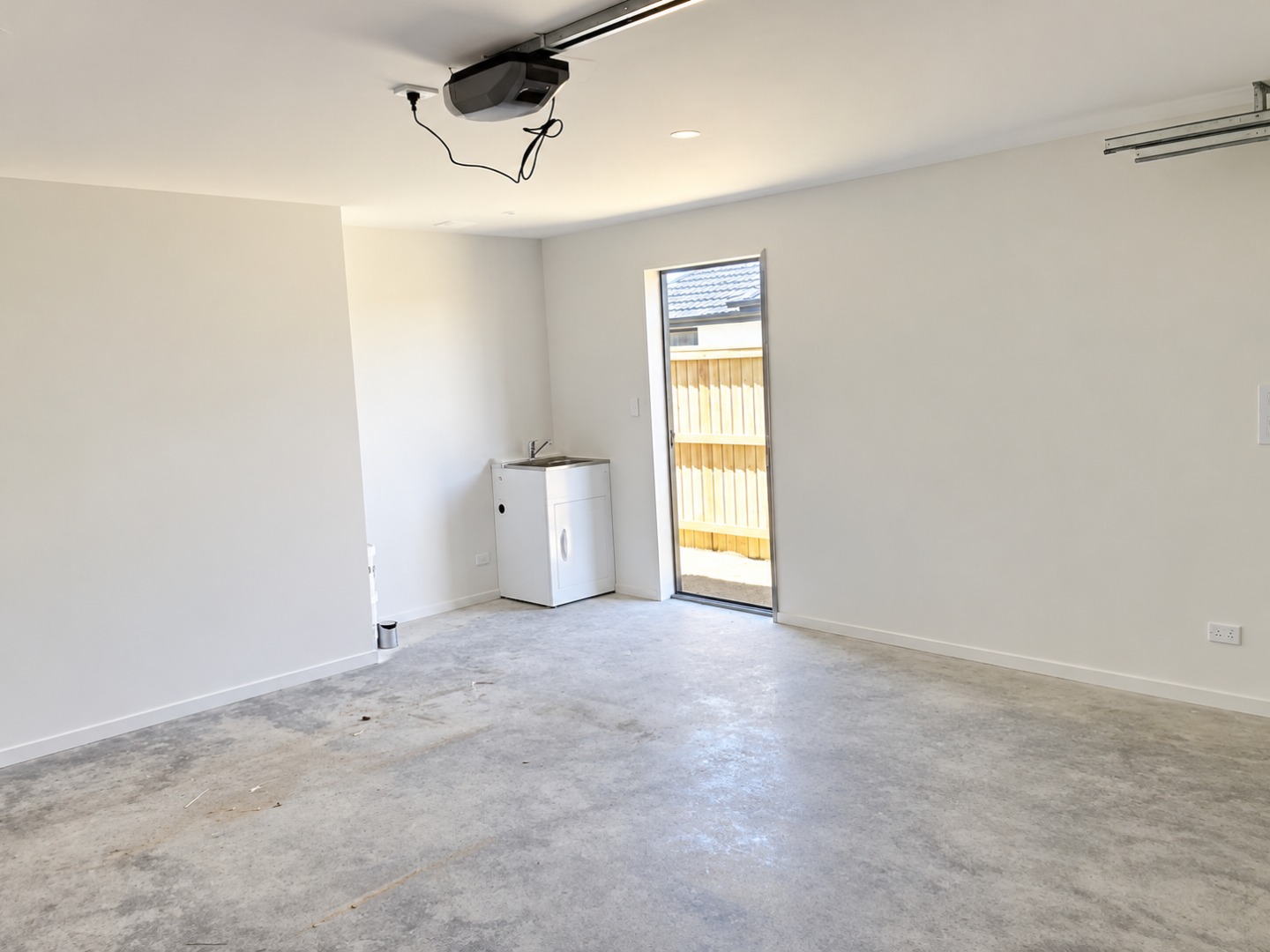 Bright Unfinished Garage Laundry Room