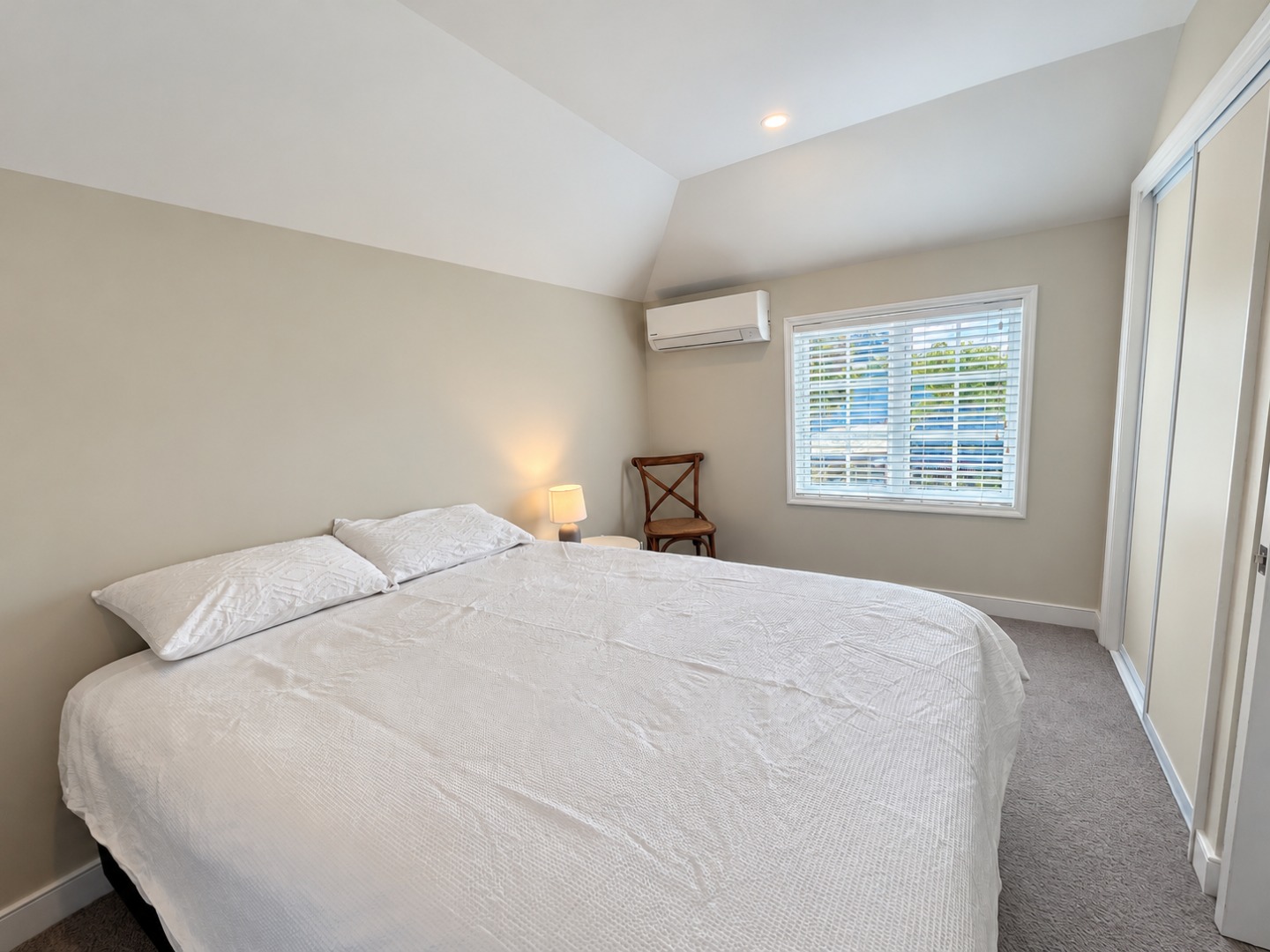 Brightened bedroom with warm lamp glow