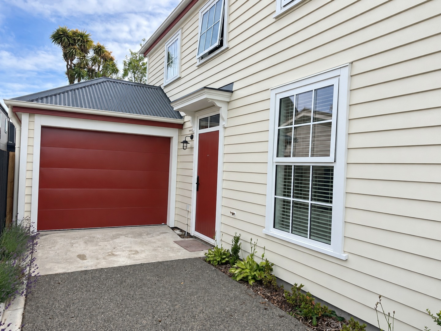 Soft daylight on a red-trimmed home