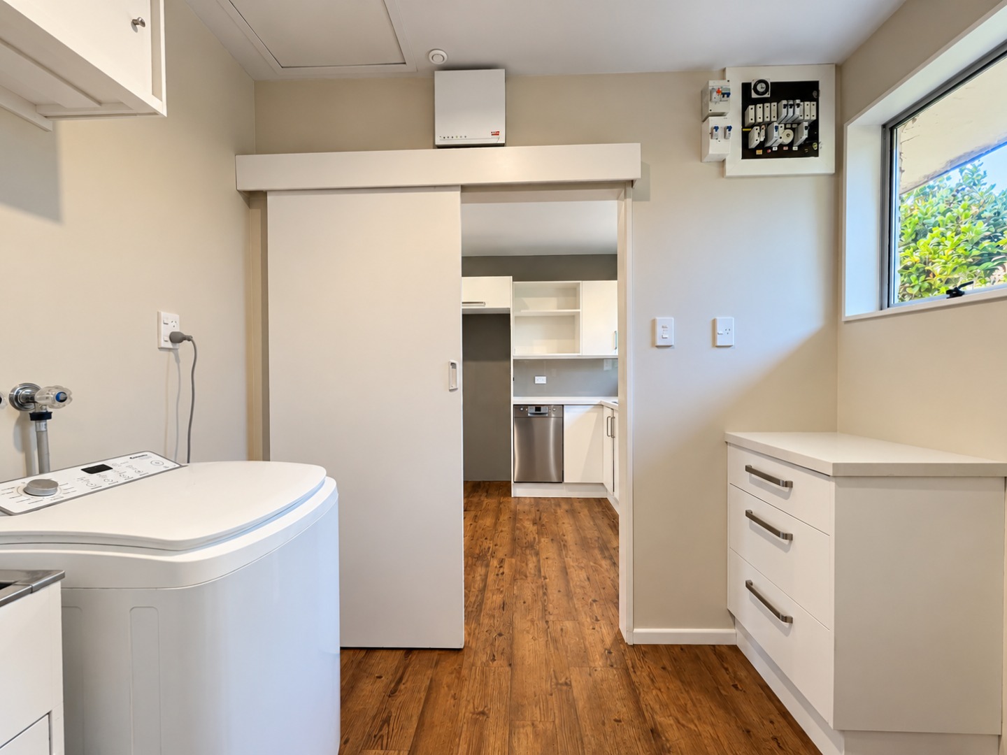 Modern Laundry Room and Kitchen View