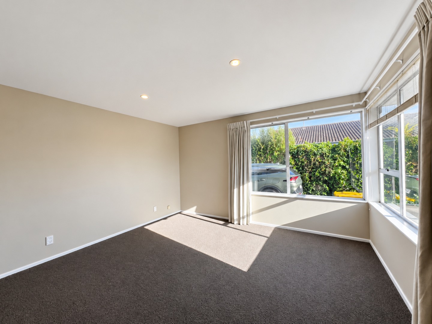 Sunlit Minimalist Room with Corner Windows