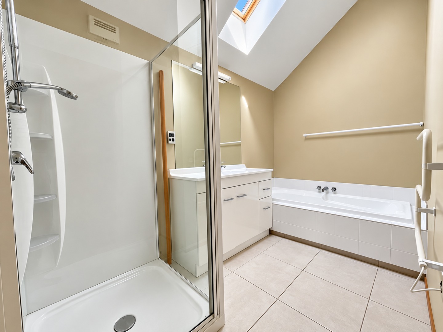 Bright Minimalist Bathroom with Skylight